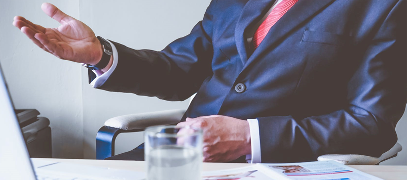 A Businessman Sitting on a Chair in the Office