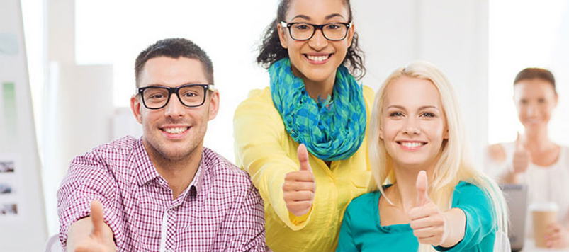 Four People Raising Their Thumbs